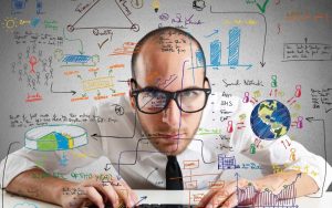 Businessman checking statistics and diagrams on pc